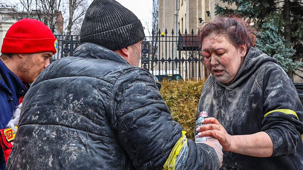 People help a wounded woman in Kharkiv, Ukraine, 1 March 2022