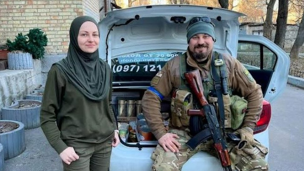 Viktoria Nesterenko with a man in military uniform