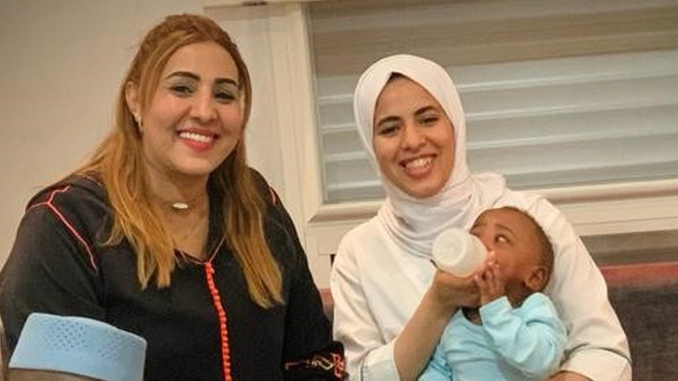 Baby with nurses