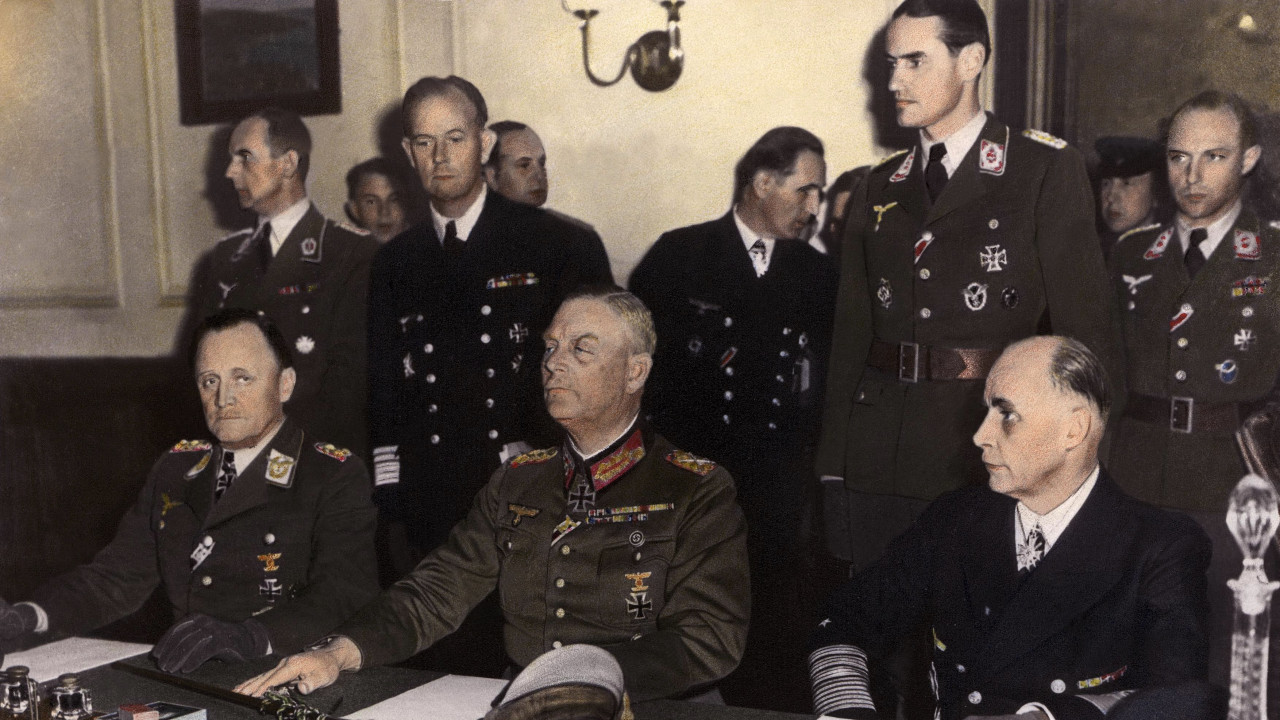 General P.H. STUMPF (left), representing the LUFTWAFFE, Marshall KEITEL (center), from the WEHRMACHT and Admiral George Hans FRIEDEBURG (right), from the German Navy signing an act of surrender of Germany at the Russian headquarters of Karlshortst, North-East of Berlin.