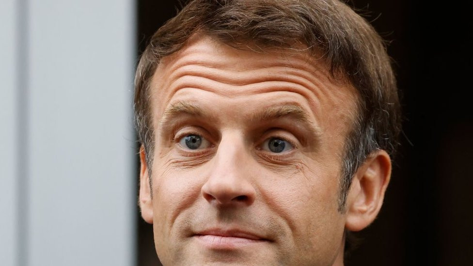 Emmanuel Macron arriving to vote in the second stage of French parliamentary elections at a polling station in Le Touquet, northern France