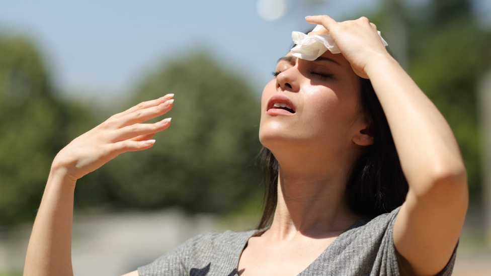 Hot day, wiping sweat
