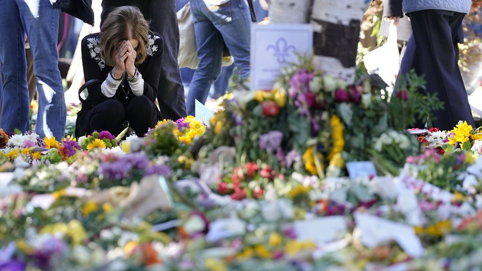 Members of the public view floral tributes in Hyde Park in London following the death of Queen Elizabeth II