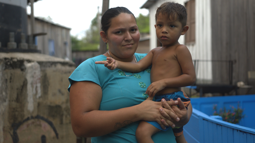 Carol Araújo, who lives as part of a small community near the centre of Manaus, Brazil