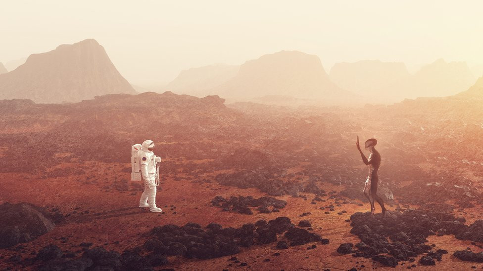 An artist's concept of a human making contact with an alien
