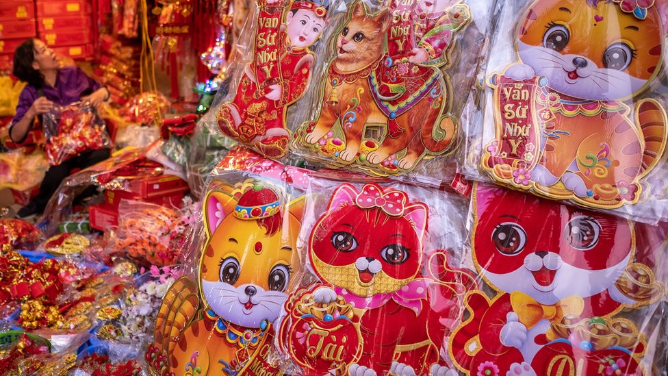 Stickers with images of a cat on display at a Tet fair in the Old Quarter of Hanoi, Vietnam