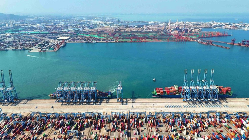 Rail lifts shuttle cargo at a container yard at Qingdao Port in Shandong province, China, 11 October 2023