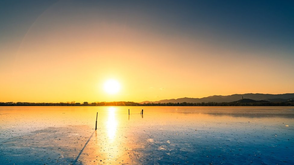 Frozen lake at sunset