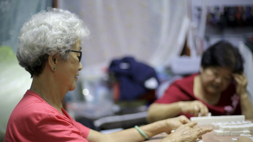 Women playing the Chinese game of mahjong