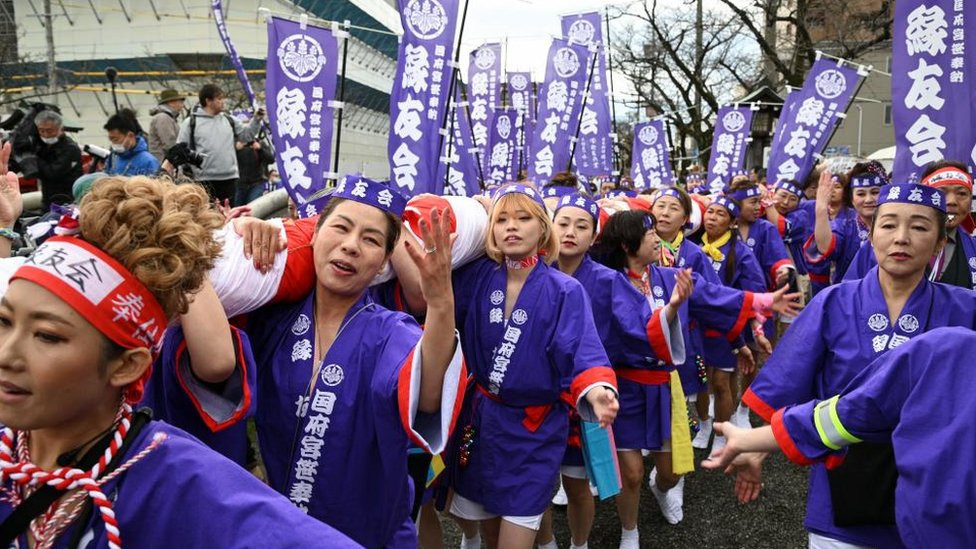 Women take part in a ritual event of naked festival