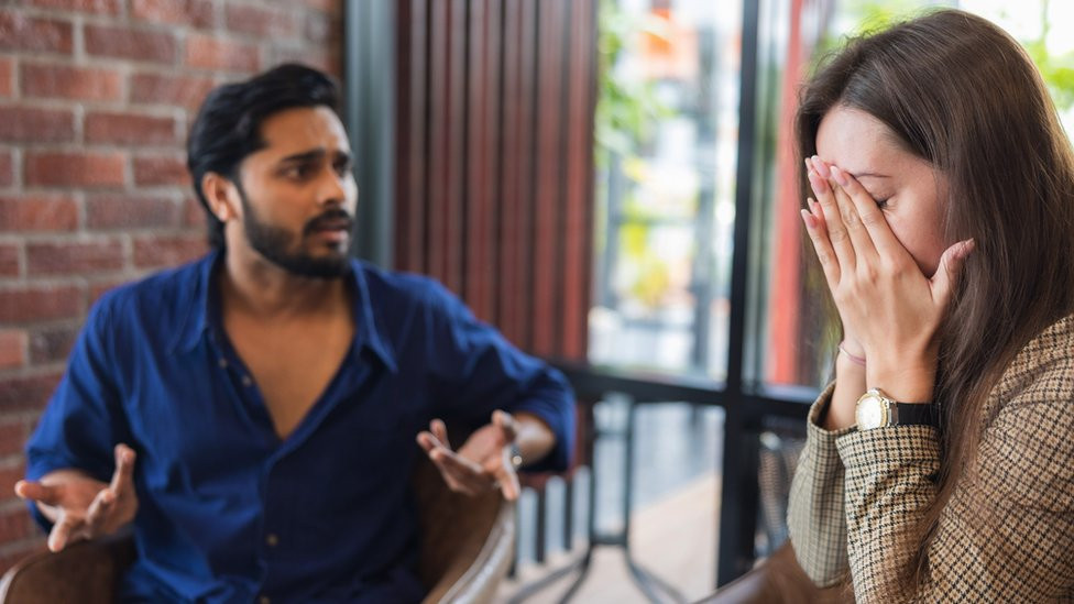 Young couple arguing while having problems in their relationship. - stock photo