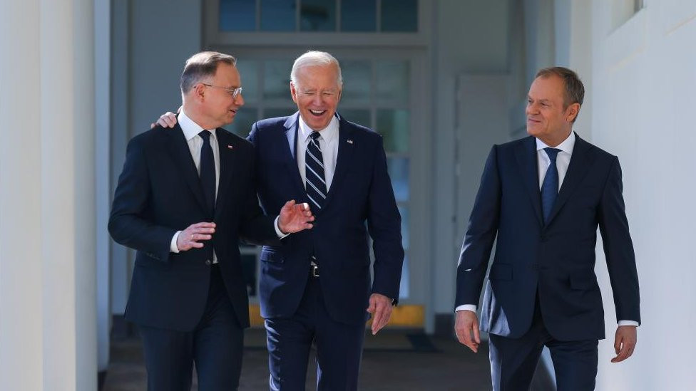 A handout picture provided by the Chancellery of the President of Poland (KPRP) shows US President Joe Biden (C), Polish President Andrzej Duda (L) and Polish Prime Donald Tusk (R), during their meeting at the White House in Washington, USA, 12 March 2024