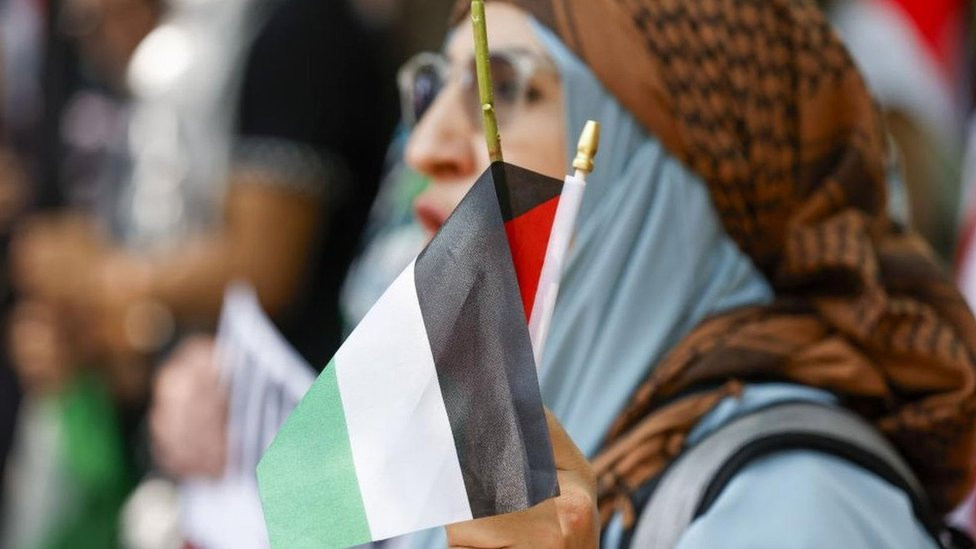 Woman with Palestinian flag