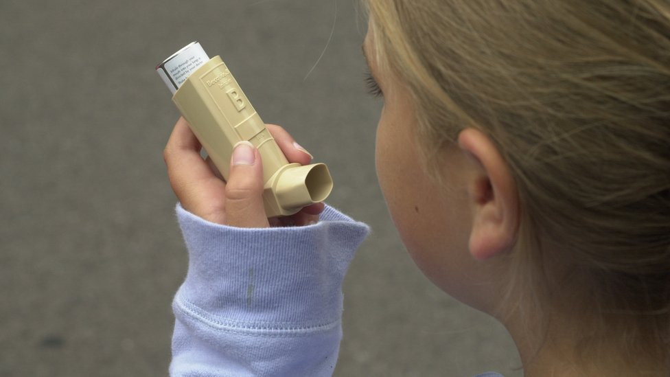 Child with asthma inhaler