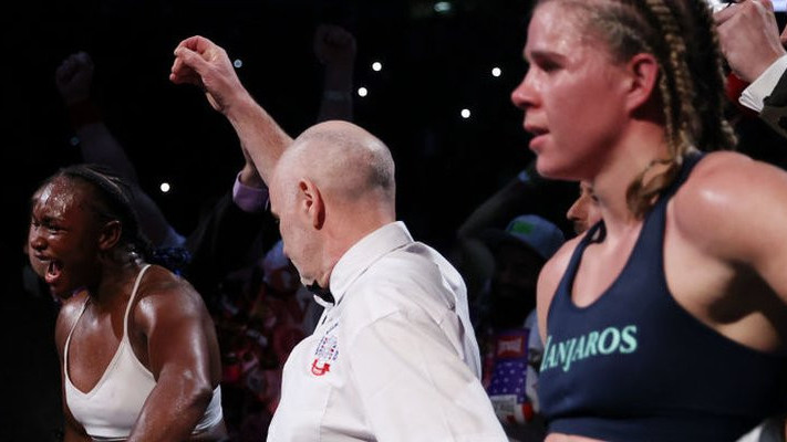 Claressa Shields celebrates while Savannah Marshall looks dispirited after their 2022 fight in London