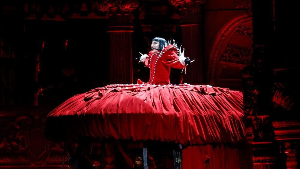 Lady Gaga performs in a red outfit with an exaggerated skirt during a free mega concert, Rio De Janeiro, Brazil
