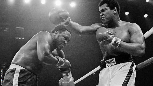 Frazier (left) would later state he hit Ali with "punches that'd bring down the walls of a city