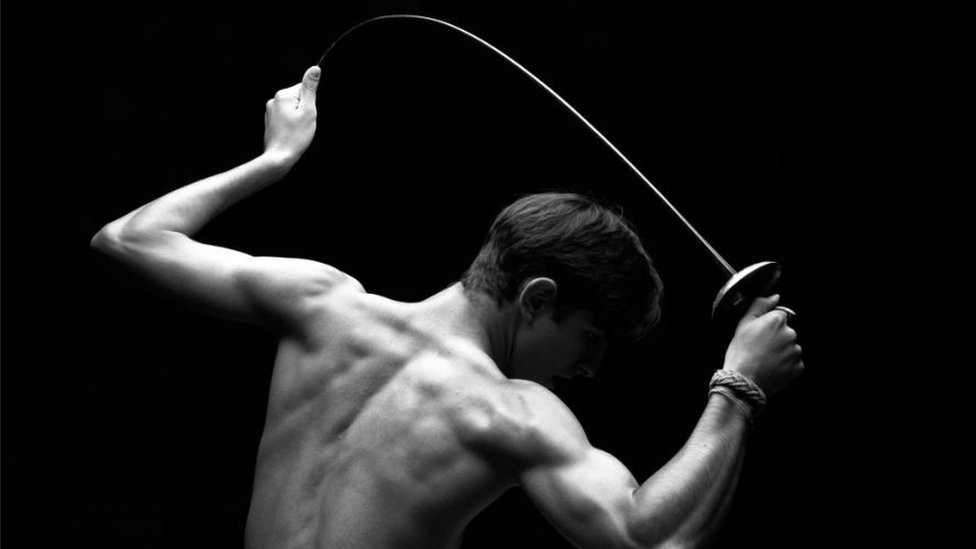 A fencer holds his saber in June of 1996 at a training facility in Atlanta, Georgia