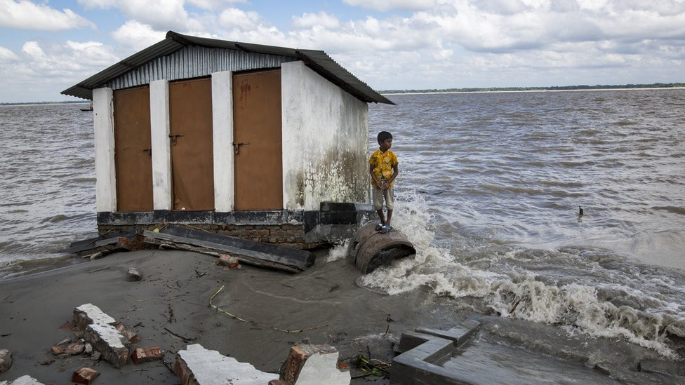 A boy who lost their belongings in river erosion takes shelter in a shelter home which is now eroded again.