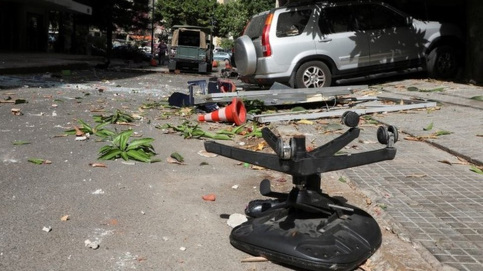 Debris strewn across a road in Beirut after gunfire erupts during protest against the judge investigating last year's blast at the city's port (14 October 2021)